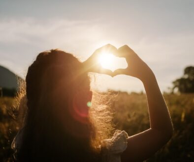 Back,View,Of,Little,Girl,Child,Making,Heart,With,Hands