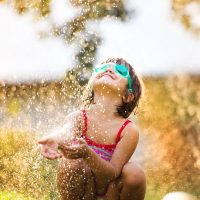 Cute,Little,Girl,Having,Fun,Outside,In,Summer,Garden